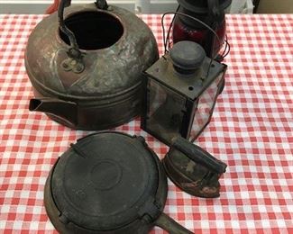 Vintage lanterns, griddle and teapot.