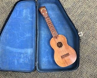 Ukelele in case.