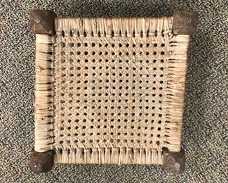 Small woven stool.