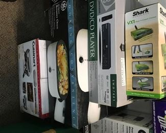 Assorted appliances and other items brand new in boxes.