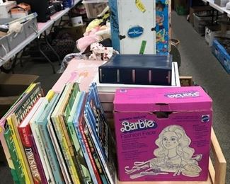 Children's books and vintage dolls.