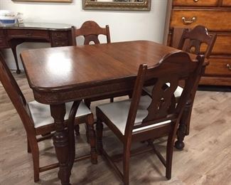 Beautiful carved antique table w/ 5 chairs & 2 leafs(8" each),  46"L x 32.5"W x 30.5"H,    $200