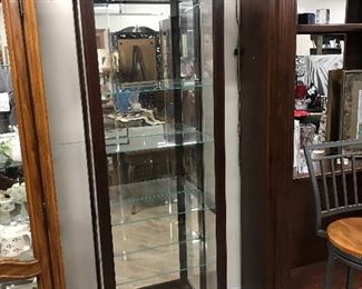 Howard Miller lighted curio cabinet,  7' H x 23"W x 12"D,   $150