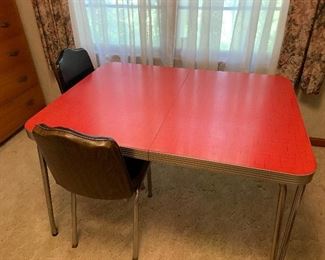 Large red  Formica table with 6 chairs