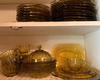 Complete set of yellow depression glass including plates, bowls, cups and saucers, and some serving pieces