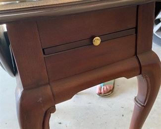Has a little drawer
$60