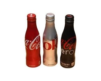 58. Three 3 CocaCola Bottles