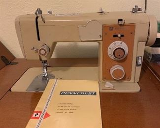 Penncrest cabinet sewing machine with attachments