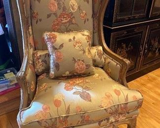 Custom Highback Wing Chair by Bruski with Silk Embroidered Upholstery and carved detail. 47”H x 28”W x 23”D $325.