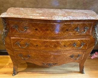 Rose Marble Top Bombe Chest with floral marquetry and brass accents.  46”W x 35”H x 20”D.  $375.