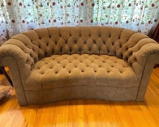 Button tufted curved suede Settee. 69”W x  35”D x  28”H.  $650.