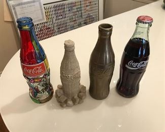 Collection of Coca Cola bottles. Brass, 1996 Olympics, Sand Sculpture and Stained Glass.
$50