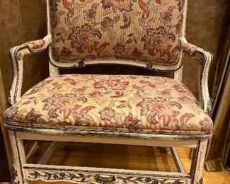 Tapestry upholstered wide armchair with carved detail. 29”W x 19”D x 40”H.  $145.