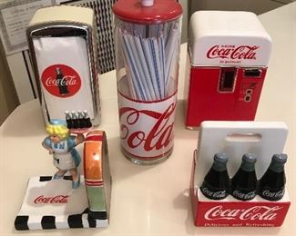 Coca Cola Collection : napkin dispenser, straw dispenser, spoon rest, napkin holder and cookie jar.
$50