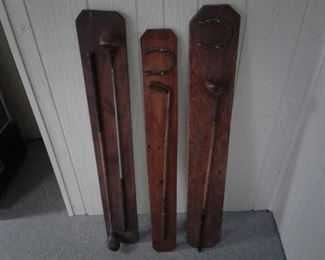 Set of 3 mounted vintage golf clubs and horseshoes.  $45. B1