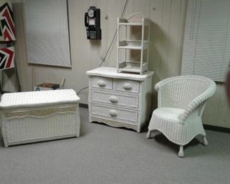 4 PC wicker furniture set includes dresser 34 x 20 x 30H, 3 tiered shelf 28 H, chair, and chest 35 x 20 x 20H. $225. B3