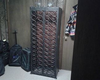 Black Metal wine rack, holds 70 bottles!  25 x 68 x 15 Deep. $75.  B10