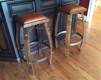 SET OF TWO BAR STOOLS MADE OUT OF WHISKEY BARRELS---SO COOL WITH LEATHER SEATS 
