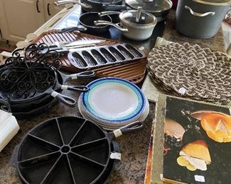 some cast iron, table linens, pots/pans