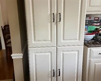 Awesome storage cabinet with shelves.