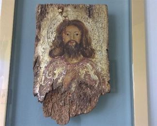 Portrait of Jesus painted on an aged piece of wood.