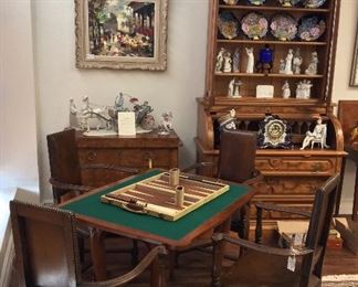 Game Table. Four Leather Arm Chairs.