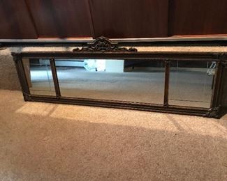 Vintage Decorative Mirror $90
This vintage mirror measures 54 ½” long x 19 ½” high.  It has an ornate decorative frame with 3 sections.  The mirrors have decorative etchings on the two side pieces.  Please note that there is one “tip” piece on the top center decorative piece that is missing.
