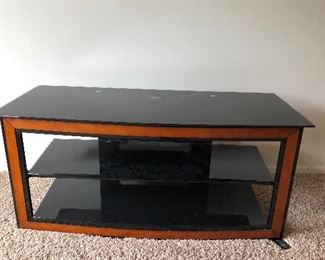 Black glass and metal/wood TV stand. 51'W x 18.5"D x 23"T BUY IT NOW $60