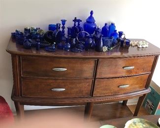 Sideboard with 4 velvet lined pull out drawers, made by Ashley Furniture 58"L x 19.25"D x 40.5" T $300 OBO ***blue glass has sold