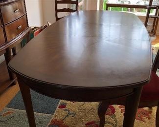 Cherry wood dining table by Ashley furniture 66" long oval with 18" leaf, 2 arm chairs and 4 side chairs $400 OBO