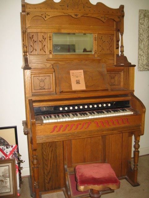 Antique pump organ.  Needs repair or transformed into a bar!