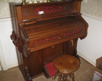 Smaller pump organ.  This one works, may need bellows work.