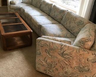 $600, U-shaped multi piece sectional, 168”x35”x27”  This is 3 pieces, the center piece is 54” and can be removed leaving a four seater curved sofa with an armless matching love seat.