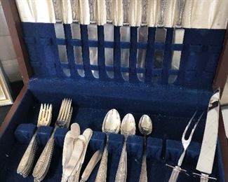 Sterling Set:  8 place settings, plus 2 teaspoons, 8 butter knives & carving set.  Weights:  each place setting (w/o knives) = 156 grams; each butter knife = 29 grams; each iced teaspoon spoon = 30.5 grams;  2 piece carving set (w stainless) 196 grams.  
$750 for entire set 