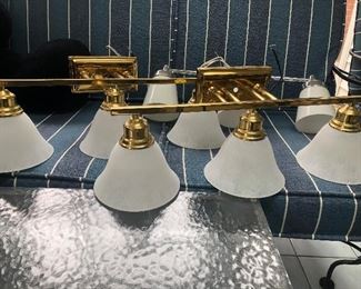 Three-light brass and glass vanity fixtures with frosted glass shades.  (2 available) Polished brass and frosted glass: NOW ONLY $20 EACH