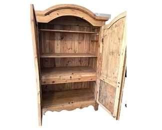 Pine Armoire with adjustable shelves and interior drawer.
