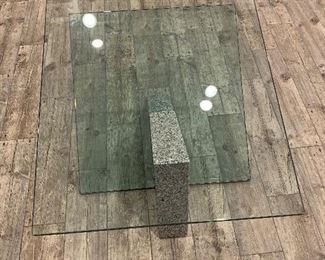 Signed glass and granite coffee table.   AS IS - one small chip on glass base and minor scratch on table top.  Dimensions 42"L x 32"W x 15 1/2" H.  PRICE: $400 for coffee and side table (2 PCS)