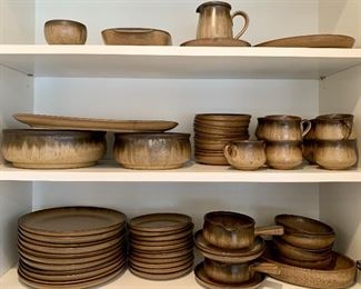 Item 25:  Denby Dinnerware Set-59pc.
(11) dinner plates, (11) salad plates, (9) cups, (11) saucers, (2) crocks/(3) saucers, (1) divided oval dish, (1) oval serving bowl, (1) large & (1) small serving platter, (1) medium & (1) large serving bowl, (1) sugar & creamer, (5) bowls.  : $350