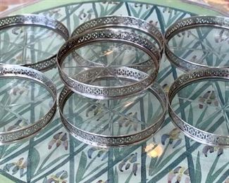 7 matching sterling and glass coasters: $35