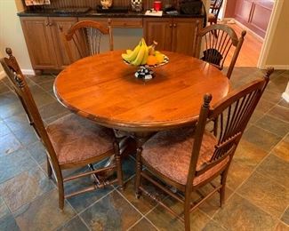 Round table and 4 chairs in great condition. n Table has one extension.  45"x30.5" - Price $950