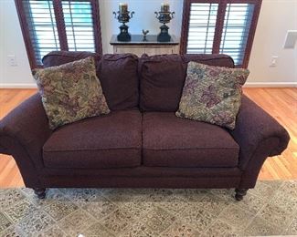 Brown upholstered loveseat on great condition.  31"x38.5"x70" - Price $750