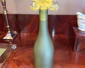Decorative frosted bottle with flower stopper $75