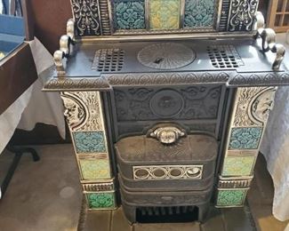 Cast stove with pottery art tiles $2,100 or best offer
