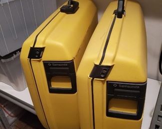 Two yellow Samsonite luggage cases and $350 for both