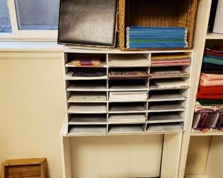 All office supplies on white shelf $10