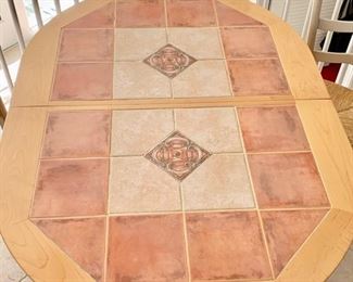 41. Tile Top Dining Table w/ 1 (18'') Leaf (60'' x 42'' x 30'')	 $ 450.00 
