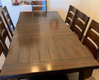 Espresso Rustic Dining Table w/ 8 Chairs	Table: 30x43x72-90in.  Chairs: 40x22x21in seat: 19in	HxWxD