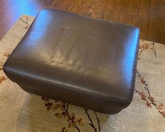Mocha colored leather ottoman	