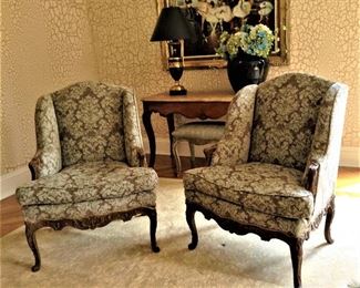 Pair of carved and upholstered french winged  armchairs  32"W x 41"H x 2'D   $1200.00 for the pair