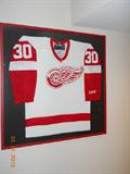 Framed, Red Wing hockey shirt.